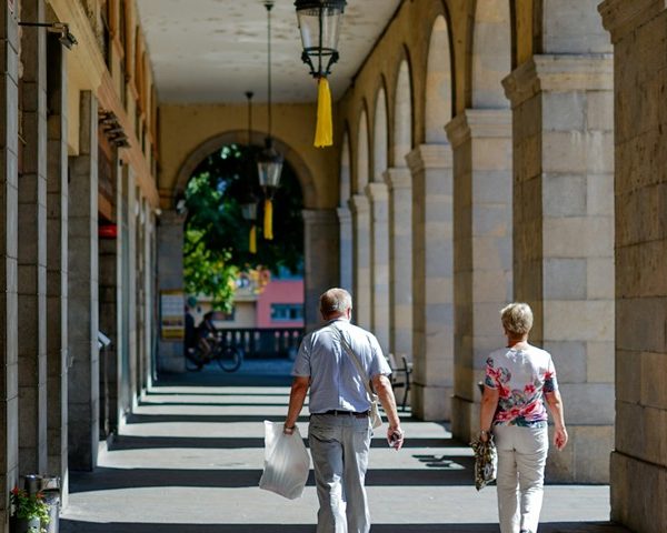 Couple Walking between Columns 052825